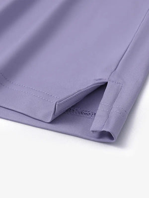 Close-up detail of hem slit on Everyday Solid Jersey Polo in LAVENDER, showcasing fine stitching.
