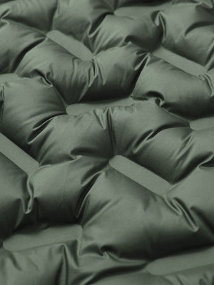 Fabric close-up showing the material of army green boys full-zip fleece-lined puffer vest.
