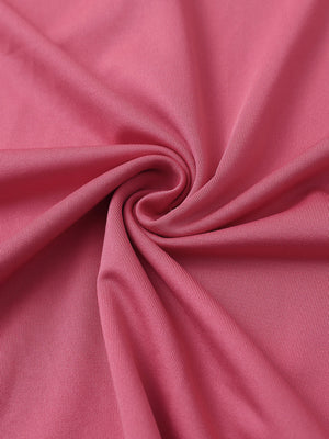 Close-up of cranberry chest print polo shirt fabric showing smooth texture and crisp graphic application area.