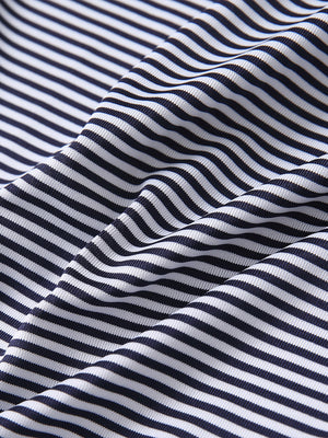 Texture close-up of Kids stripe golf polos with soft fabric and bright navy stripe stripes