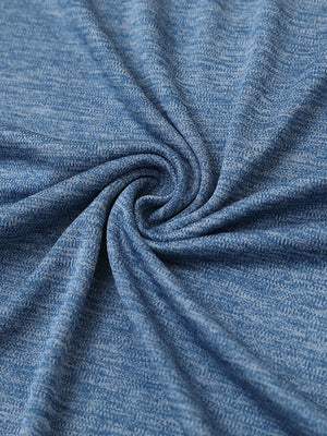 Close-up of grayish blue heather modern fit melange polo fabric showing soft and textured surface.