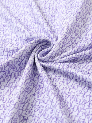 Close-up of purple wine glass performance jersey print polo fabric showing breathable texture.