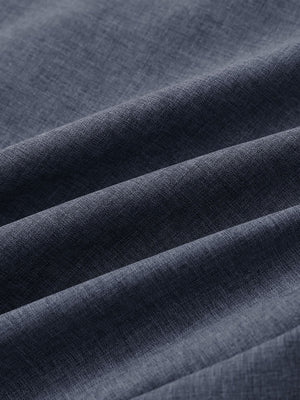 Close-up of navy heather performance golf shorts fabric showing moisture-wicking texture.
