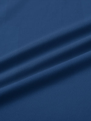 Fabric detail of Long sleeve performance solid pique polo with breathable knit in blue