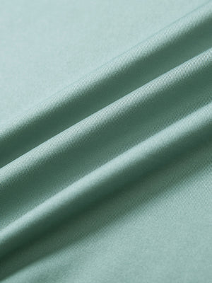 Close-up of beryl green everyday classic solid polo fabric texture.