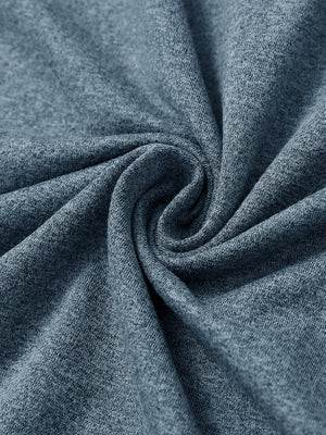 Close-up of melange fabric on quarter zip pullover, showing texture and detail in saxony blue melange.