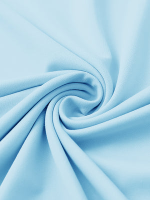 Close-up of fabric on stylish chest print snap polo, showing texture and finish in light blue.