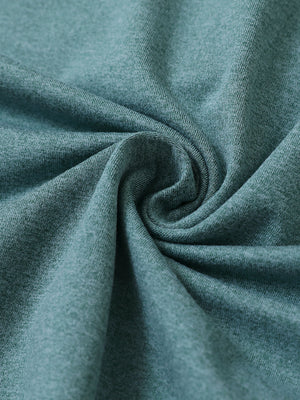 Fabric close-up of quarter zip hoodie with kangaroo pocket, soft texture and cozy feel in aqua heather