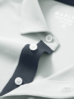 Detail shot of the collar on the silver gray ventilated pique performance polo, emphasizing the classic neckline design