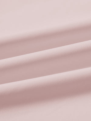 Fabric close-up of print collar quarter zip golf vest, smooth material with subtle texture in light pink