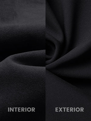 Close-up fabric detail of water-resistant fleece lined pants, soft inner lining and durable black exterior