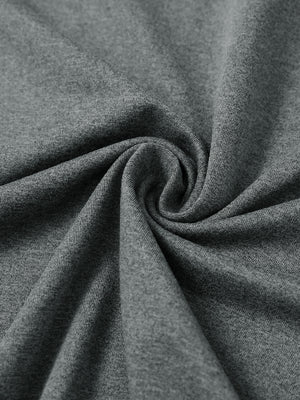Close-up of fabric on men's long sleeve mock turtleneck shirt, soft knit texture with subtle stretch in black grey heather