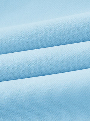 Close-up of wrinkle-resistant, sun-protective fabric on water-resistant golf stretch nylon pants in light blue.