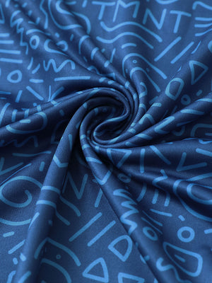 Fabric close-up of Everyday performance print polo with lightweight texture in blue graffiti