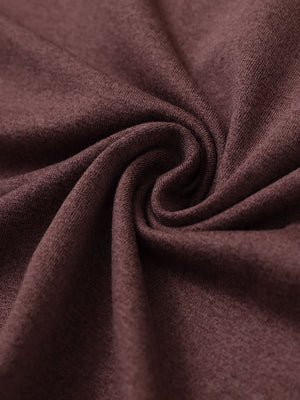 Close-up fabric detail of skin-friendly long sleeve melange polo, soft blend texture with brick heather tone