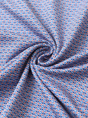 Close-up of blue white oval performance jersey print polo fabric texture.