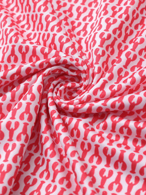 Close-up of red lobster golf performance print boys golf polo fabric showing moisture-wicking texture 