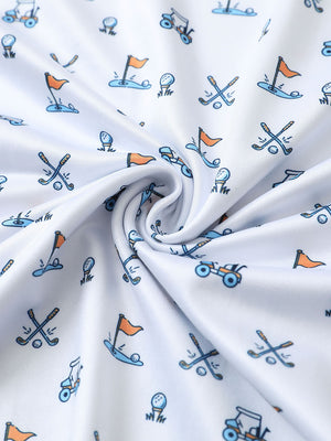 Close-up of white golf performance print boys golf polo fabric showing moisture-wicking texture and vibrant pattern.