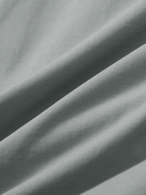 Close-up texture of rose dust stretch cotton blend slim fit golf trousers 5 pockets fabric showing detailed cotton blend weave.