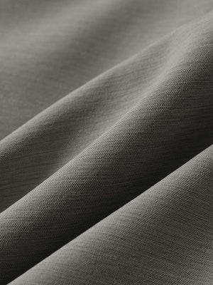 Close-up texture of tea brown flat front hybrid golf shorts fabric showing detailed hybrid material and weave.