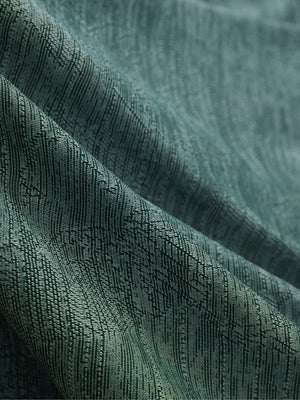 Close-up of green leaf breathable jacquard pattern 3-button golf polo fabric texture