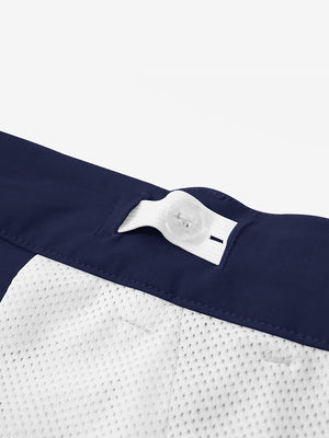 Interior shot of the waistband on the dark blue youth water resistant cotton blend golf pants, showing inner construction