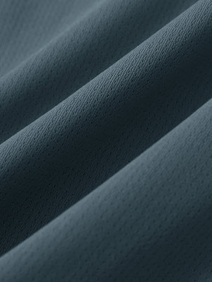 Close-up of soft mesh fabric for misty blue superion softness mesh joggers with zipper pockets