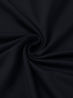 Close-up of black everyday solid jersey polo fabric showing soft knit texture and smooth surface.