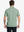 Back half-body shot of model showcasing the back of Sport Fit Stripe Polo in Dark Green Stripe