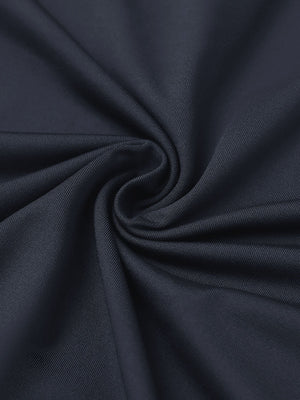 Close-up of dark grey everyday solid jersey polo fabric showing soft knit texture and smooth surface.