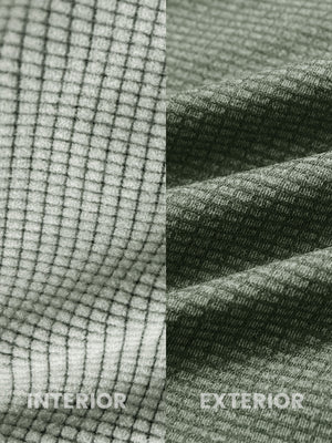 Close-up of melange fabric on warm fleece golf hoodies pullover, showing texture and detail in green melange.