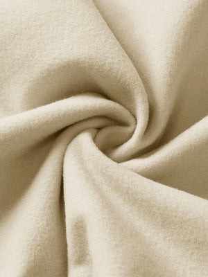 Fabric close-up of light khaki boys stretch fleece lined casual golf pants, soft stretch fabric with warm fleece lining.