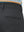 Close-up of the back pocket detail on the dark grey youth water resistant cotton blend golf pants, emphasizing storage
