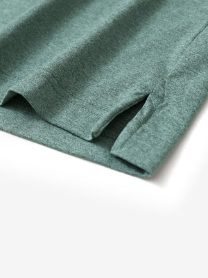 Hem detail of Skin-friendly long sleeve melange polo with neat stitching in dark green heather