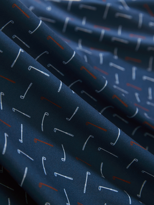 Close-up of red white golf club lightweight stretch upgraded print golf polo shirts, showcasing texture and print details.