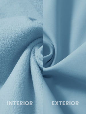 Fabric close-up of reflective hooded softshell jacket, showing texture and finish in misty blue.